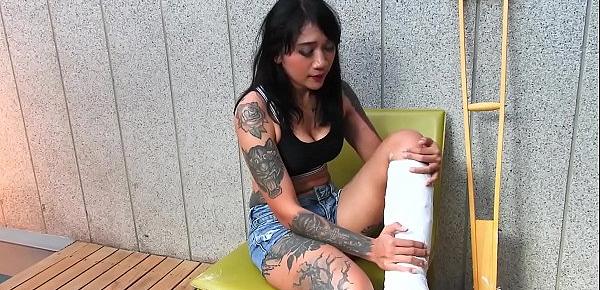  Tattooed Asian model with short cast leg